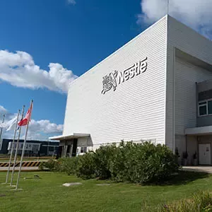 Nestlé manufacturing facility with modern production buildings and company branding